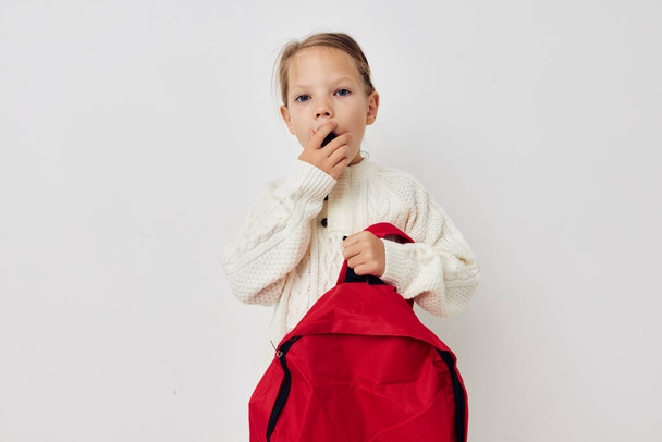 little girl red backpack stylish clothes isolated background - Foto, Imagem