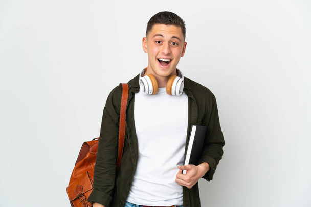 Young caucasian student man isolated on white background with surprise facial expression - Photo, Image