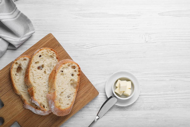 Flat lay composition with freshly baked sodawater bread on white wooden table. Space for text - Zdjęcie, obraz