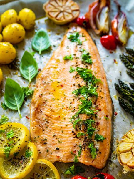 One sheet pan roast trout fillet with potatoes, asparagus and vegetables - Photo, image