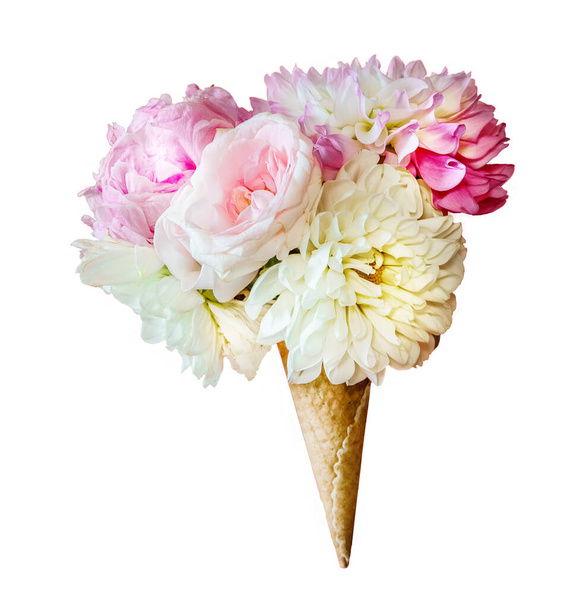 fresh flowers in a sweet waffle cone as ice cream isolated over white background, gift, summer or wedding decoration ideas. High quality photo - Photo, Image