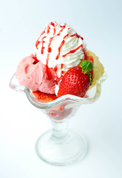 Cup with three balls of banana, cream and strawberry ice cream - Fotografie, Obrázek