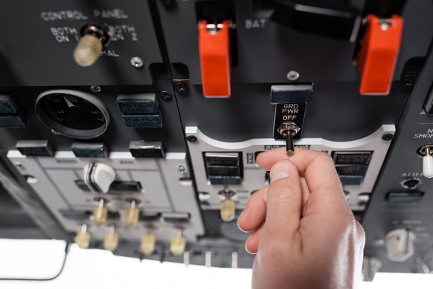 widok przycięty pilota przy użyciu wyłącznika zasilania poza siecią w symulatorze samolotu  - Zdjęcie, obraz