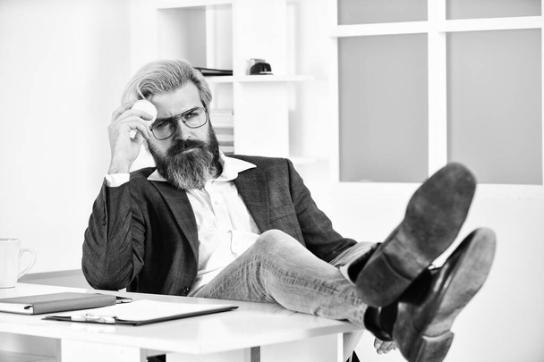 Hipster play tennis ball. Burnout and lack of ideas. Crisis concept. Successful man entrepreneur formal business suit sitting office interior. Business manager relaxing. Office job. Business concept - Foto, Imagem