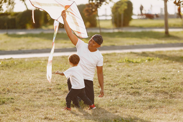 Father and son having fun in summer park - Valokuva, kuva