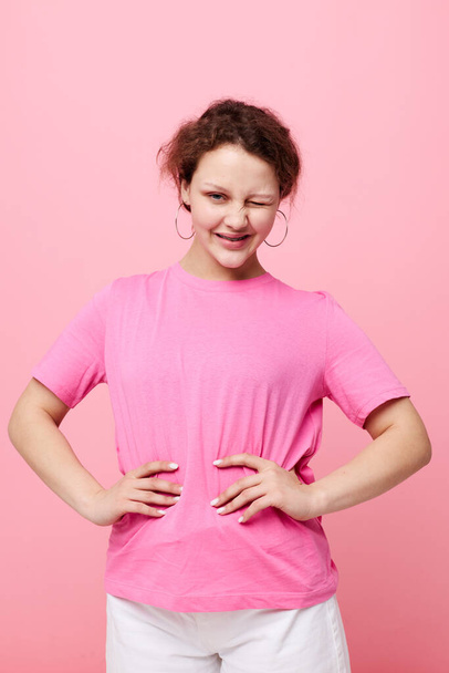 attractive young woman in a pink T-shirt Youth fashion Lifestyle unaltered - Foto, immagini