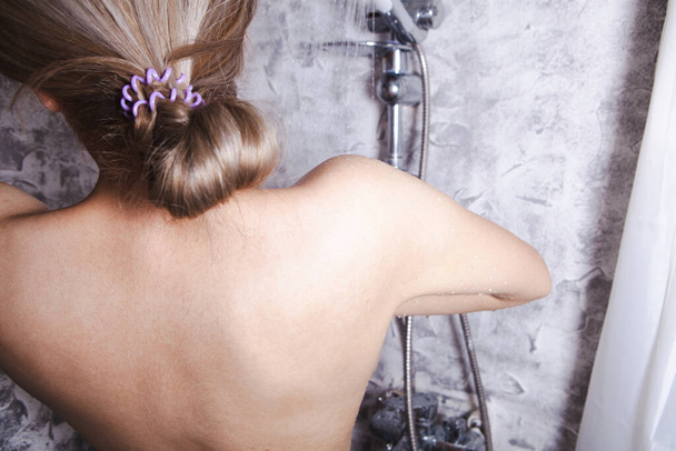 young woman washing herself in the shower - Foto, Imagen