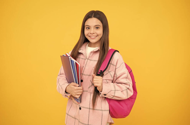 childhood and education. cheerful student hold notebooks and books. back to school. - Photo, Image
