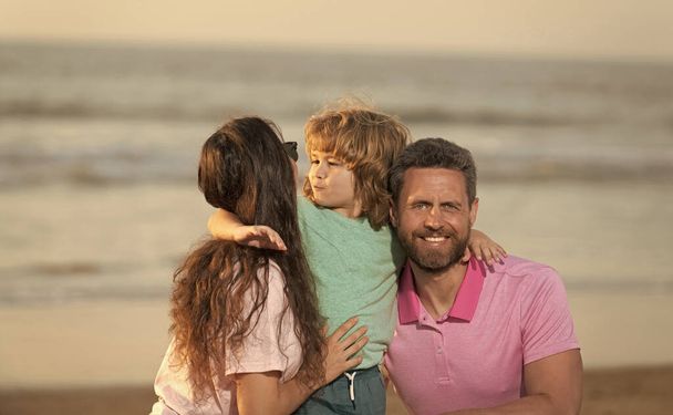 friendly family. family travel vacation. happy parents with kid boy. mom dad and son love relax - Photo, Image
