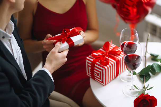 Valentine's Day concept. Romantic Date. Young couple celebrating Valentine's Day in the restaurant.  - Foto, immagini