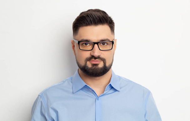 Portrait of a business man in glasses with a beard on a white background. - Foto, imagen