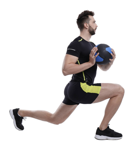 Athletic man doing exercise with medicine ball isolated on white - Fotografie, Obrázek