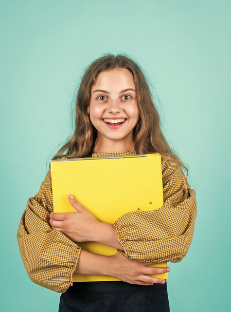 happy looking kid girl with document folder, back to school - Foto, Imagen