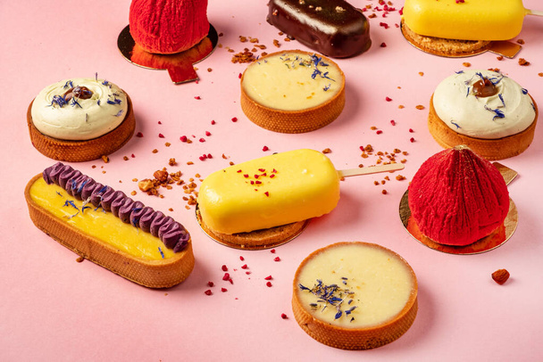 french pastries on the pink background - Valokuva, kuva