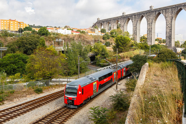 Lisbon, Portugal - September 24, 2021 Train rail railway at aqueduct Aqueduto das Aguas Livres in Lisbon Lisboa, Portugal. - Fotografie, Obrázek