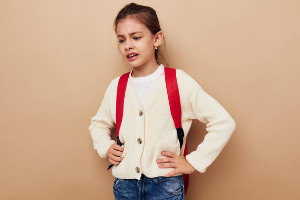 pretty young girl schoolgirl with red backpack posing Lifestyle unaltered - Fotó, kép