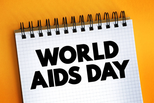 Παγκόσμια Ημέρα κατά του AIDS κείμενο σε σημειωματάριο, φόντο έννοια - Φωτογραφία, εικόνα