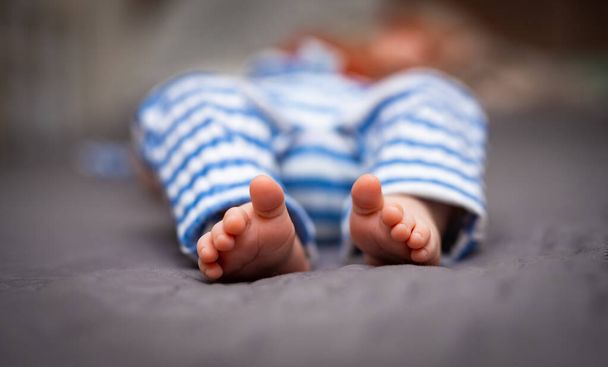 Feet of baby newborn is sleeping. Close up. Stock photo - Photo, Image