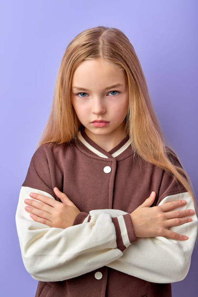 cute teenage girl with negative expression, angry in casual clothing and look at camera - Foto, imagen