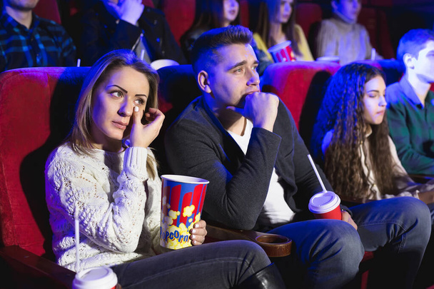 Friends crying watching sad film in the cinema. - Zdjęcie, obraz