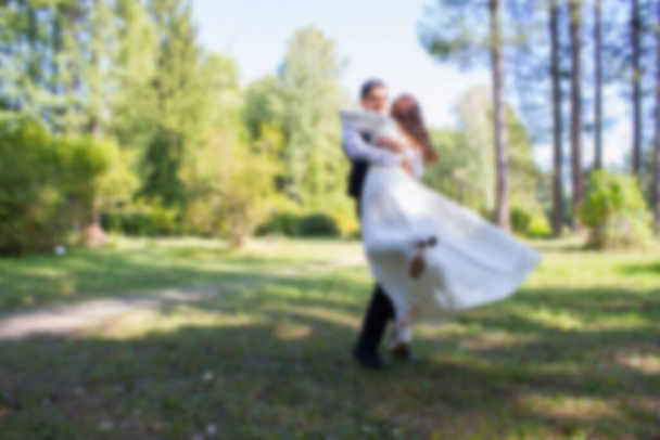 Bride and groom on nature background. Blurred - Photo, Image