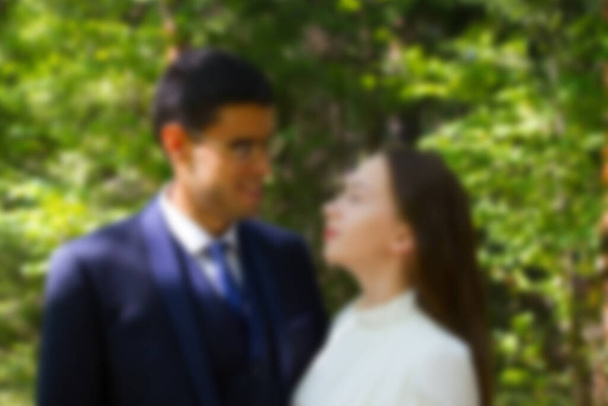 Bride and groom on nature background. Blurred - Fotografie, Obrázek