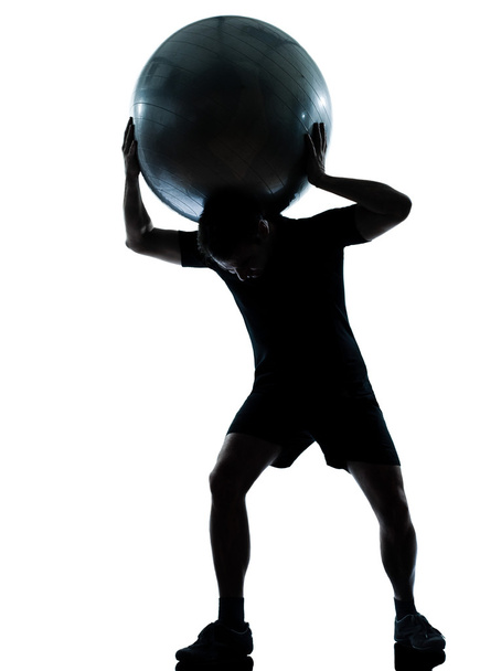 man workout holding fitness ball silhouette - Photo, Image