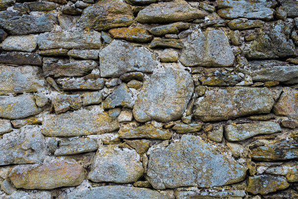 Stone wall. Outdoor background natural stone. - Фото, зображення
