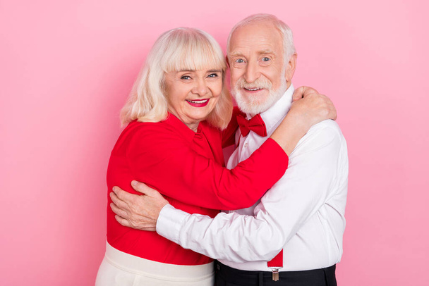 Portrait of attractive amorous cheery gray-haired couple hugging dance isolated over pink pastel color background - Foto, Imagem