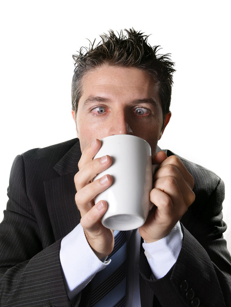 addict business man in suit and tie drinking cup of coffee anxious and crazy in caffeine addiction - Foto, Imagen
