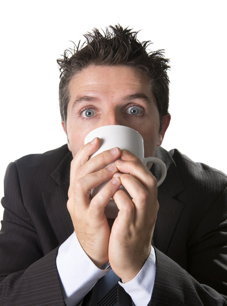 addict businessman in suit and tie holding cup of coffee as maniac in caffeine addiction - Photo, Image