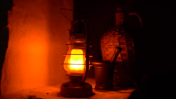 Close-up of a classic incandescent lamp. Glass bulb, inert gas and tungsten filament. Soft natural light. Lamp velvet effect. Is flaring up brighter and brighter. - Footage, Video