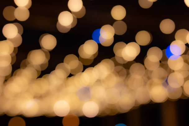Golden bokeh background, glare of light in the form of circles. - Photo, Image