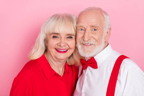 Portrait of attractive amorous cheery gray-haired couple bonding anniversary isolated over pink pastel color background - Foto, Bild