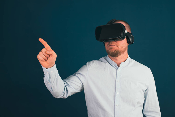 Metaverse digital cyber world technology. Businessman with VR glasses using AR augmented reality. NFT, futuristic lifestyle concept - Фото, зображення