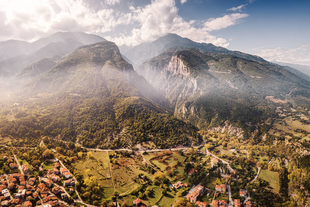 Aerial drone panoramic view of deep gorge and rocky ridge leading to legendary Mountain Olympus - the pantheon of all Greek gods and Great Zeus. Natural and National Parks in Greece - Photo, Image
