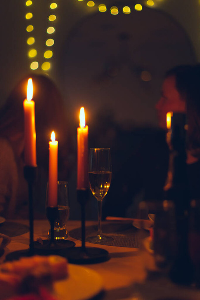 Feast with candles for the New Year or Christmas. - Фото, зображення