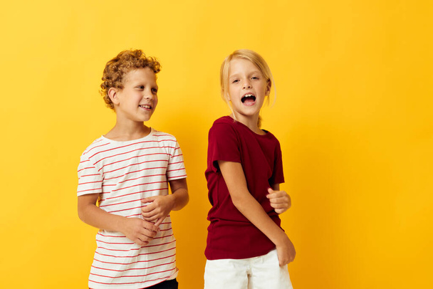 two joyful children cuddling fashion childhood entertainment isolated background - Foto, imagen