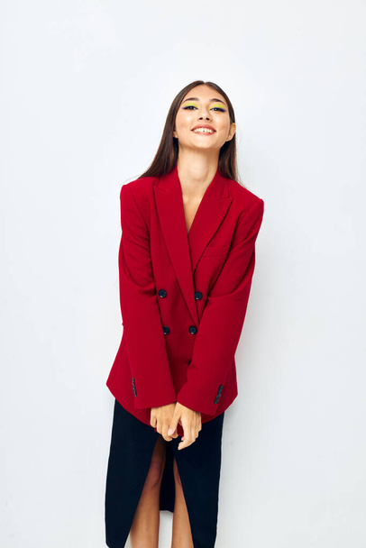 portrait pretty woman in a red jacket cosmetics smile Lifestyle unaltered - Foto, Imagem
