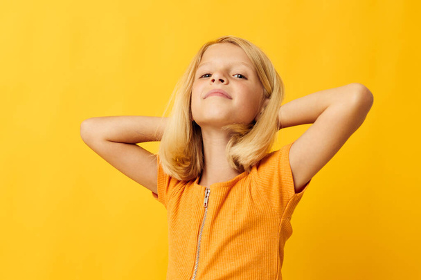 Little girl blonde straight hair posing smile fun color background unaltered - 写真・画像