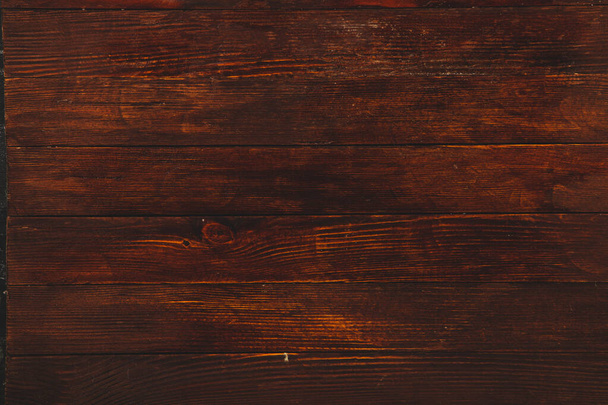 Textura de fondo de madera marrón vintage con nudos y agujeros para uñas. Antigua pared de madera pintada. Fondo abstracto marrón. Tableros horizontales oscuros de madera vintage. Vista frontal con espacio de copia - Foto, Imagen