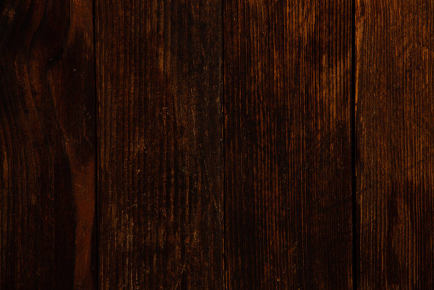 Vintage brown wood background texture with knots and nail holes. Old painted wood wall. Brown abstract background. Vintage wooden dark horizontal boards. Front view with copy space - Foto, Bild