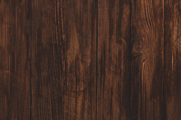 Ročník hnědé dřevo pozadí textury s uzly a otvory na nehty. Stará dřevěná zeď. Hnědé abstraktní pozadí. Vintage dřevěné tmavé horizontální desky. Přední pohled s mezerou pro kopírování - Fotografie, Obrázek