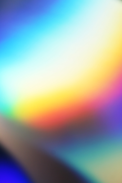 Texture holographique réelle dans des couleurs bleu-rose-vert avec des rayures et des irrégularités. Feuille arc-en-ciel holographique fond abstrait. - Photo, image