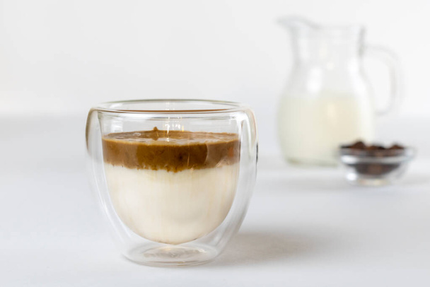 Cold dalgona coffee. Whipped instant coffee. Popular coffee. Latte espresso with coffee foam in a glass. - 写真・画像