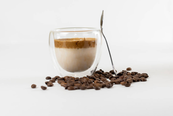 Cold dalgona coffee. Whipped instant coffee. Popular coffee. Latte espresso with coffee foam in a glass. - Photo, Image