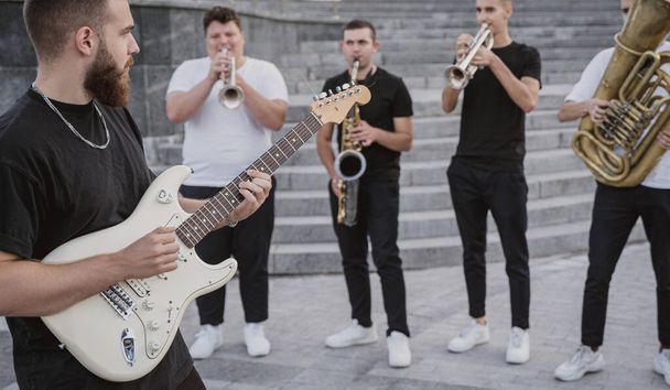 Young street music band play a lot of musical instruments - Valokuva, kuva