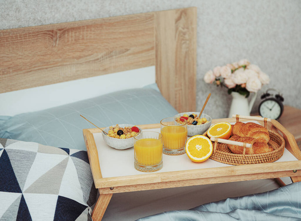 Romantic breakfast with coffee, waffles, orange juice and rose flowers.  - Φωτογραφία, εικόνα