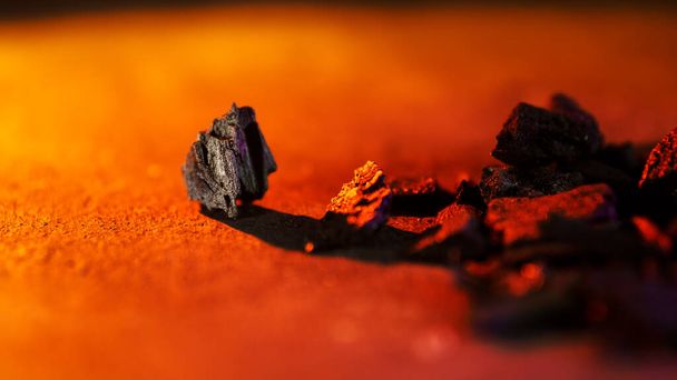 Charcoal on an orange background - Valokuva, kuva