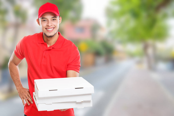 Pizza delivery latin man boy order delivering bringing deliver box young town copyspace copy space outdoors - Fotoğraf, Görsel